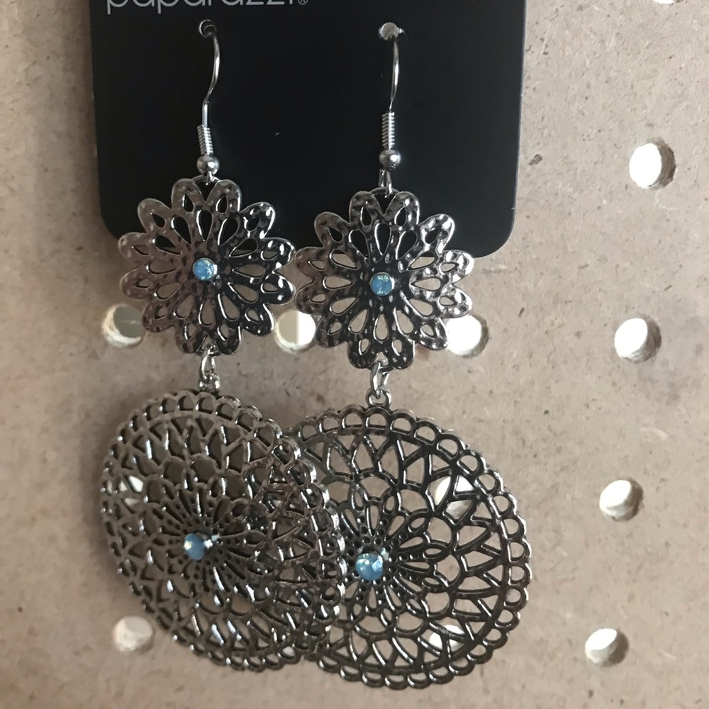 Long silver filigree circles w/tiny blue stones.
